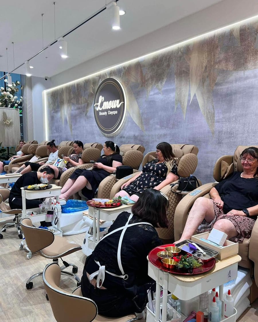 The L’mour salon floor at Plumpton Marketplace, with massage pedicure chairs under the lit logo wall